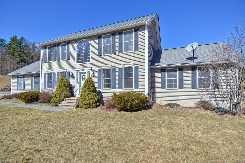 47 Hidden Road Dracut, MA 01826 - Photo 1 of 28 a front view of a house with a yard