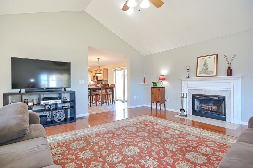 47 Hidden Road Dracut, MA 01826 - Photo 13 of 28 a living room with furniture and a fireplace or television
