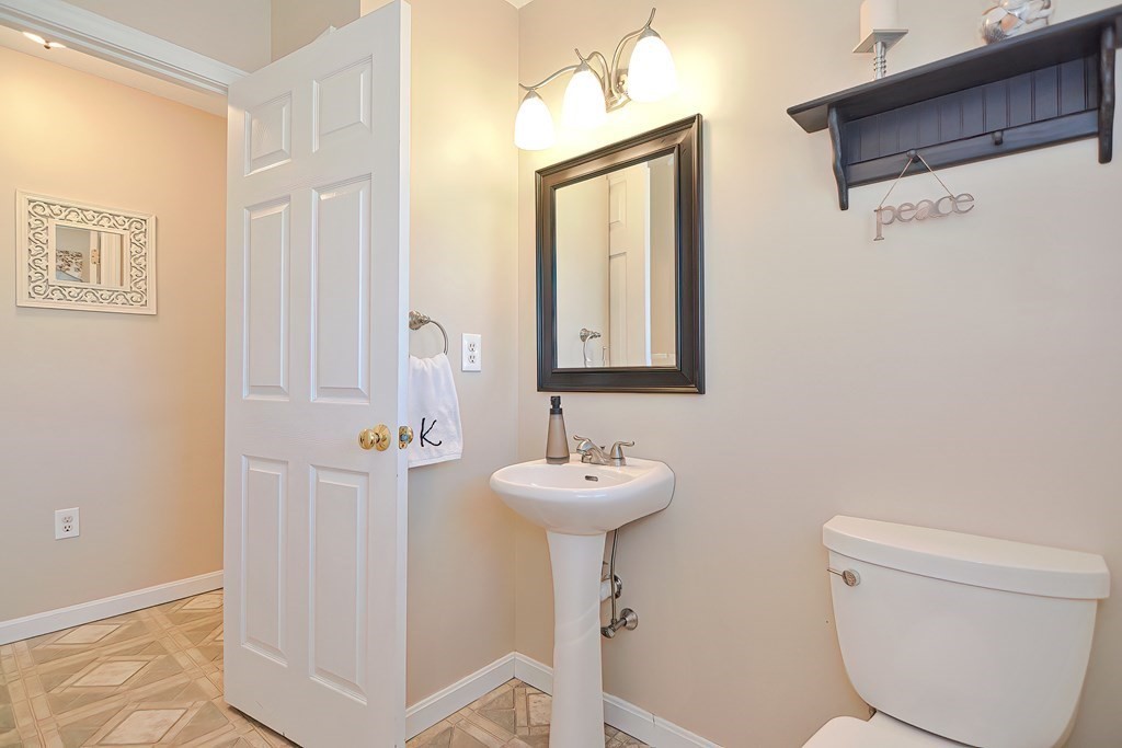 47 Hidden Road Dracut, MA 01826 - Photo 14 of 28 a bathroom with a sink toilet and a mirror