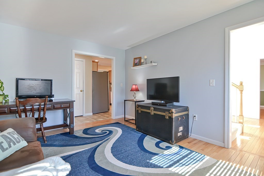 47 Hidden Road Dracut, MA 01826 - Photo 15 of 28 a living room with furniture and a flat screen tv