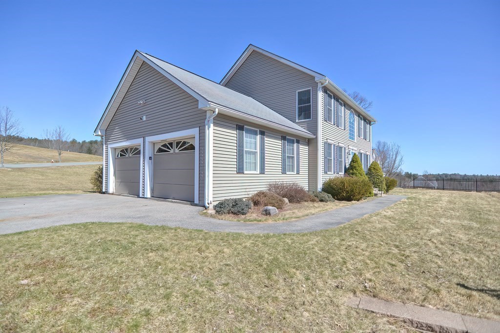 47 Hidden Road Dracut, MA 01826 - Photo 2 of 28 a front view of a house with a yard