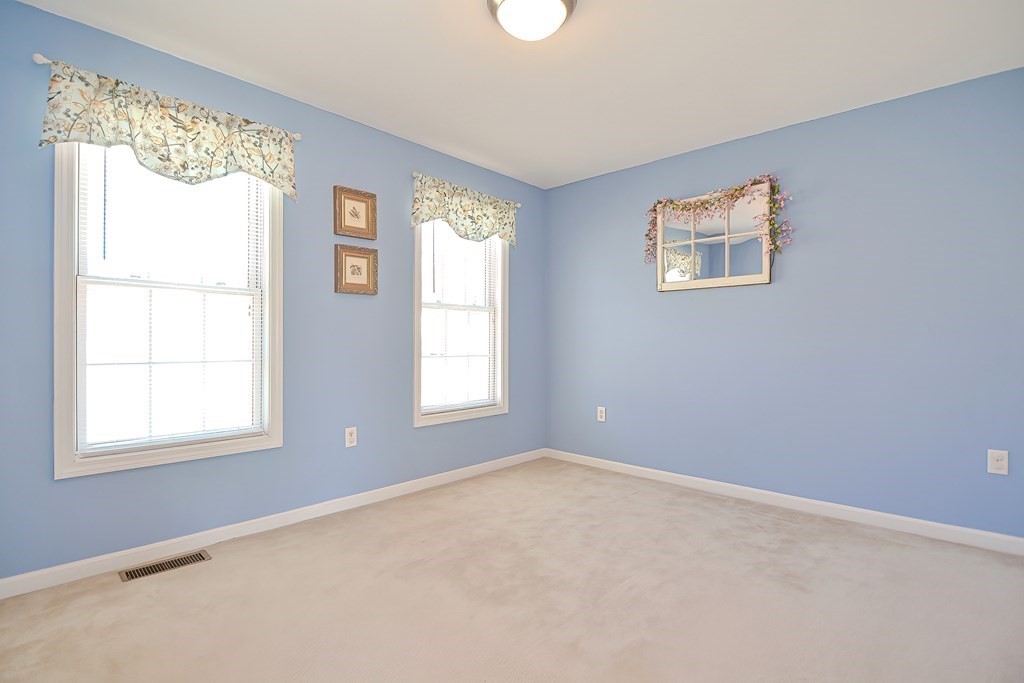 47 Hidden Road Dracut, MA 01826 - Photo 22 of 28 an empty room with a window