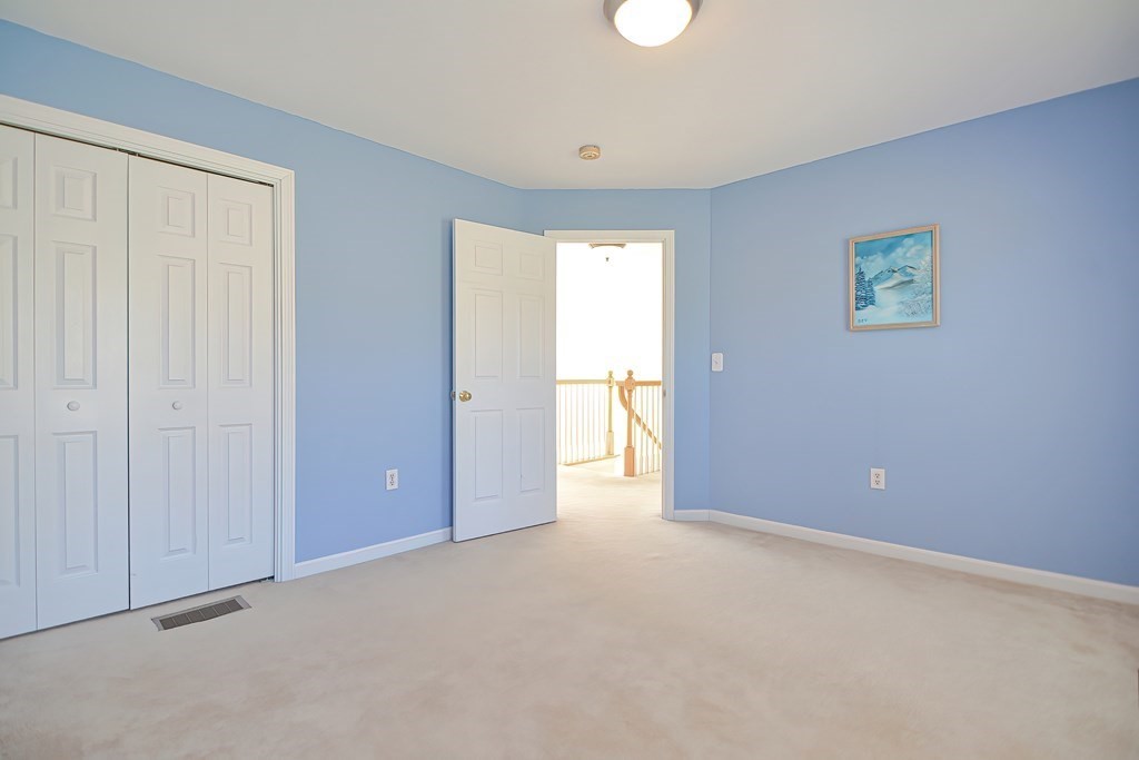 47 Hidden Road Dracut, MA 01826 - Photo 23 of 28 a view of an empty room with a window