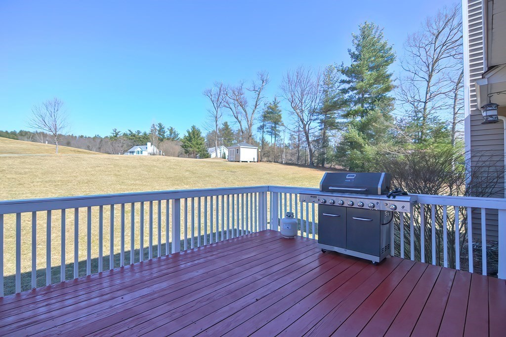 47 Hidden Road Dracut, MA 01826 - Photo 26 of 28 a view of deck with wooden floor and fence