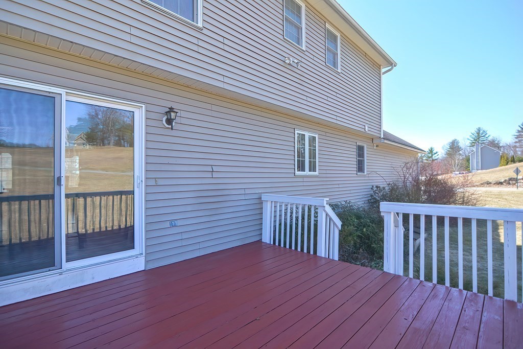 47 Hidden Road Dracut, MA 01826 - Photo 27 of 28 a view of a wooden deck