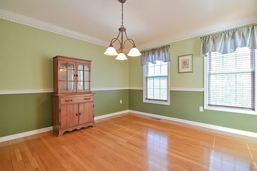 47 Hidden Road Dracut, MA 01826 - Photo 9 of 28 a bedroom with a bed and a window