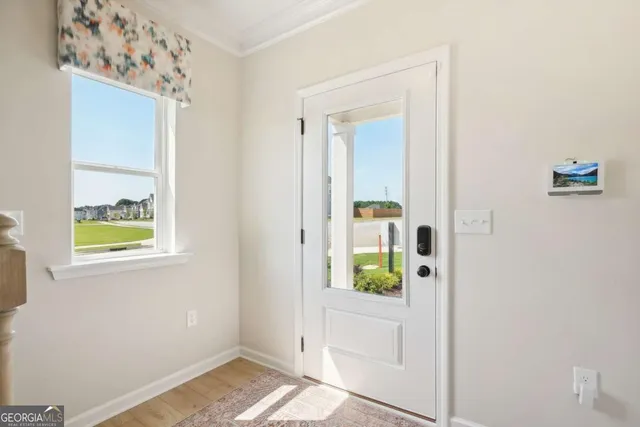 a view of kitchen with wooden floor and window