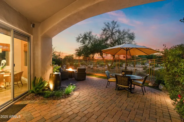 a view of a swimming pool with a lounge chair and a floor to ceiling window