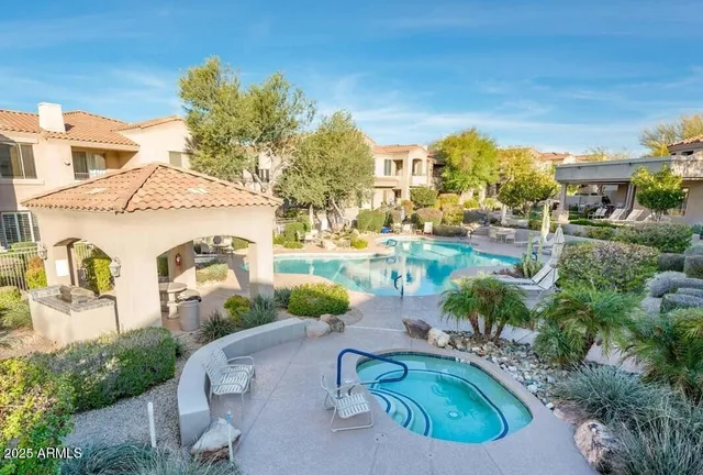 a backyard of a house with outdoor seating