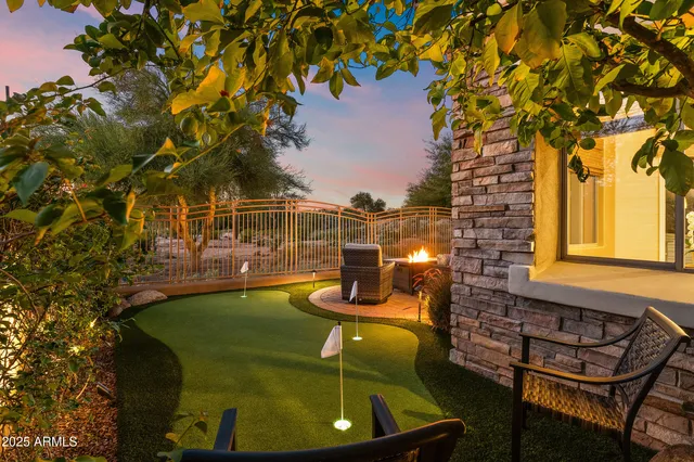 a view of a swimming pool with an outdoor seating