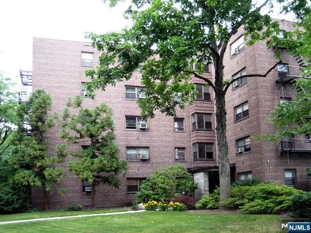 a aerial view of a house with a yard and plants