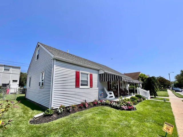 a view of backyard with a garden and entertaining space