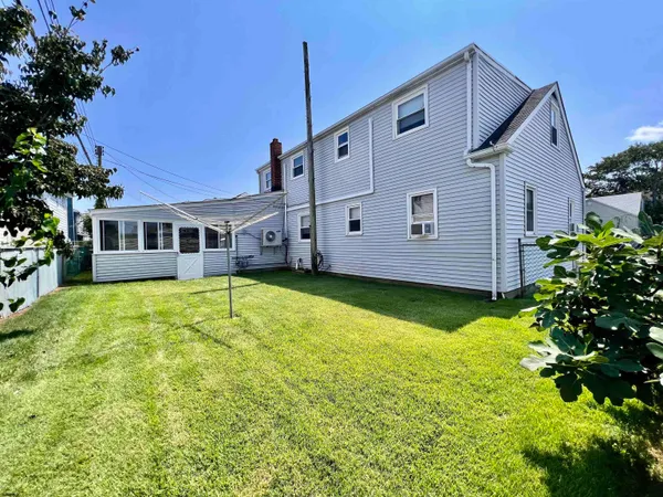 a view of a house with a backyard