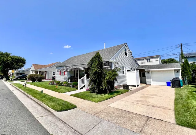 a view of house with outdoor space and street view