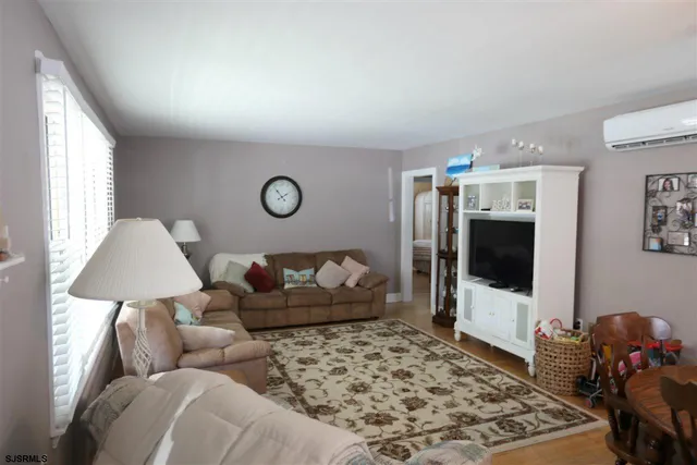 a living room with a couch and a flat screen tv
