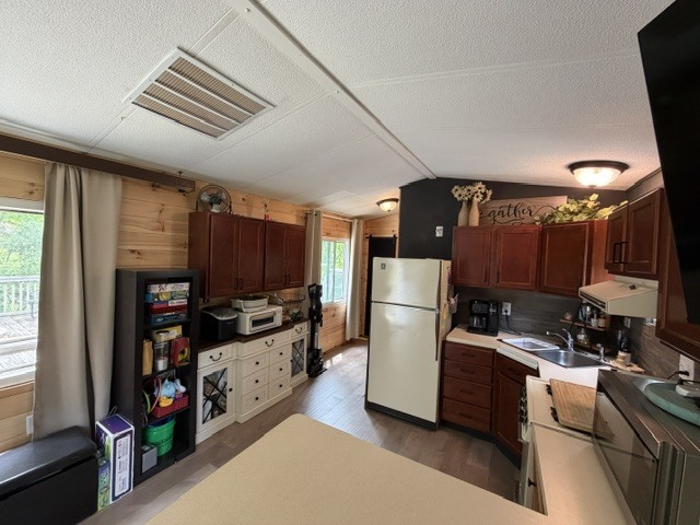 2795 East 28th Road Marseilles, IL 61341 - Photo 9 of 58 a kitchen with refrigerator and cabinets