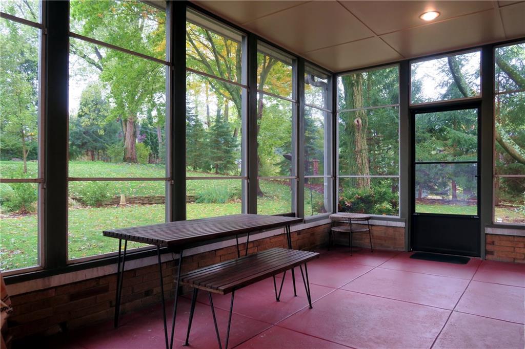 5 Holland Road Pittsburgh, PA 15235 - Photo 21 of 25 Rear Screened-In Porch: 12x21, looks out to park-like back yard. Can be accessed from either Living Room or Kitchen.