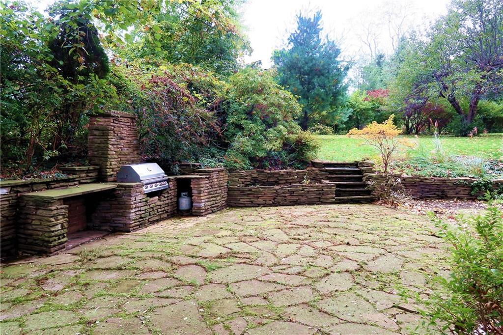 5 Holland Road Pittsburgh, PA 15235 - Photo 23 of 25 Natural stone patio with field stone grill area.