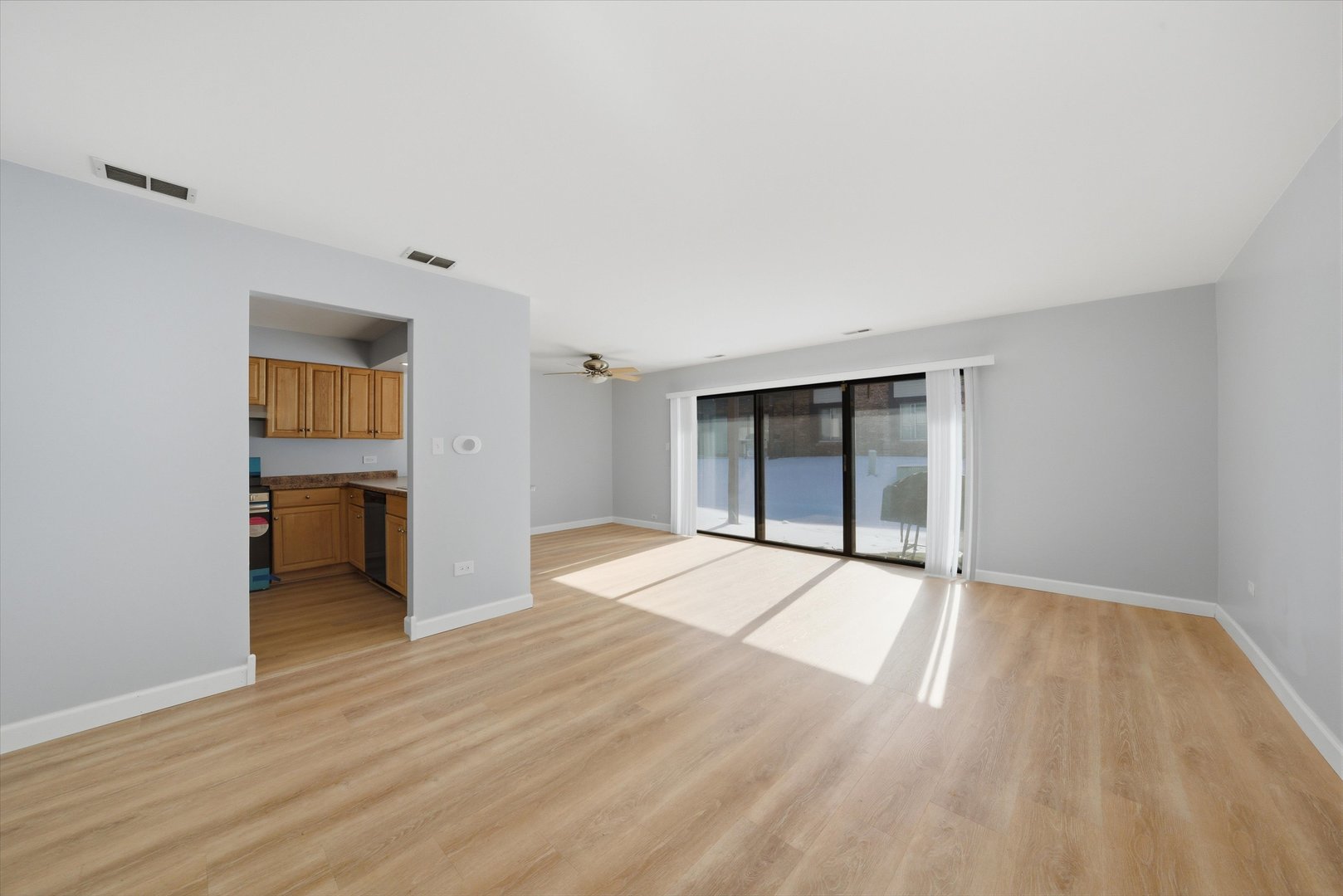 3207 West 184th Street, Unit 1A Homewood, IL 60430 - Photo 11 of 16 a view of an empty room with wooden floor and a window