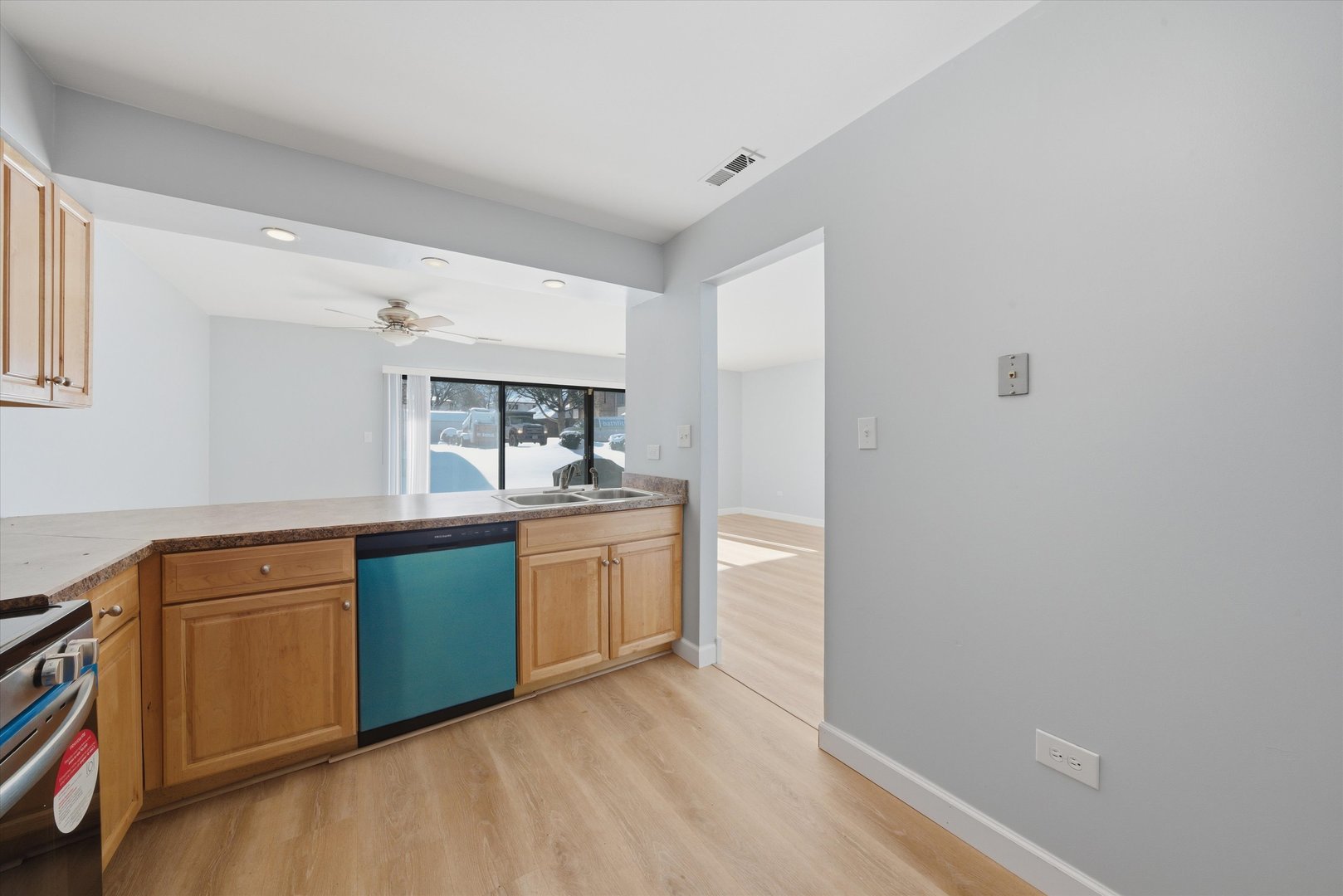 3207 West 184th Street, Unit 1A Homewood, IL 60430 - Photo 12 of 16 a kitchen with granite countertop a sink and cabinets