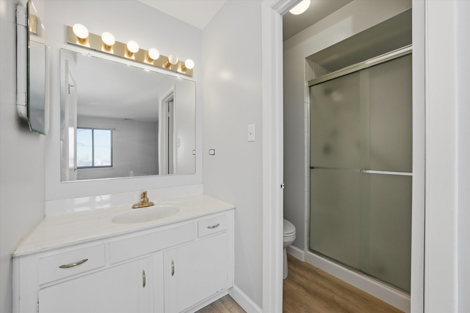 3207 West 184th Street, Unit 1A Homewood, IL 60430 - Photo 15 of 16 a bathroom with a double vanity sink mirror and shower