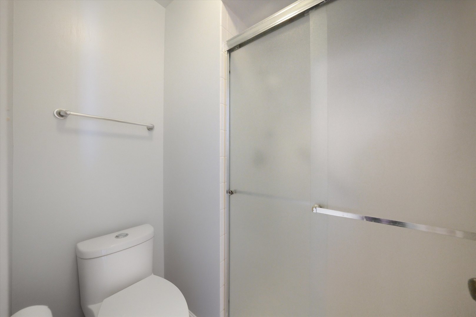 3207 West 184th Street, Unit 1A Homewood, IL 60430 - Photo 5 of 16 a white toilet sitting next to a shower