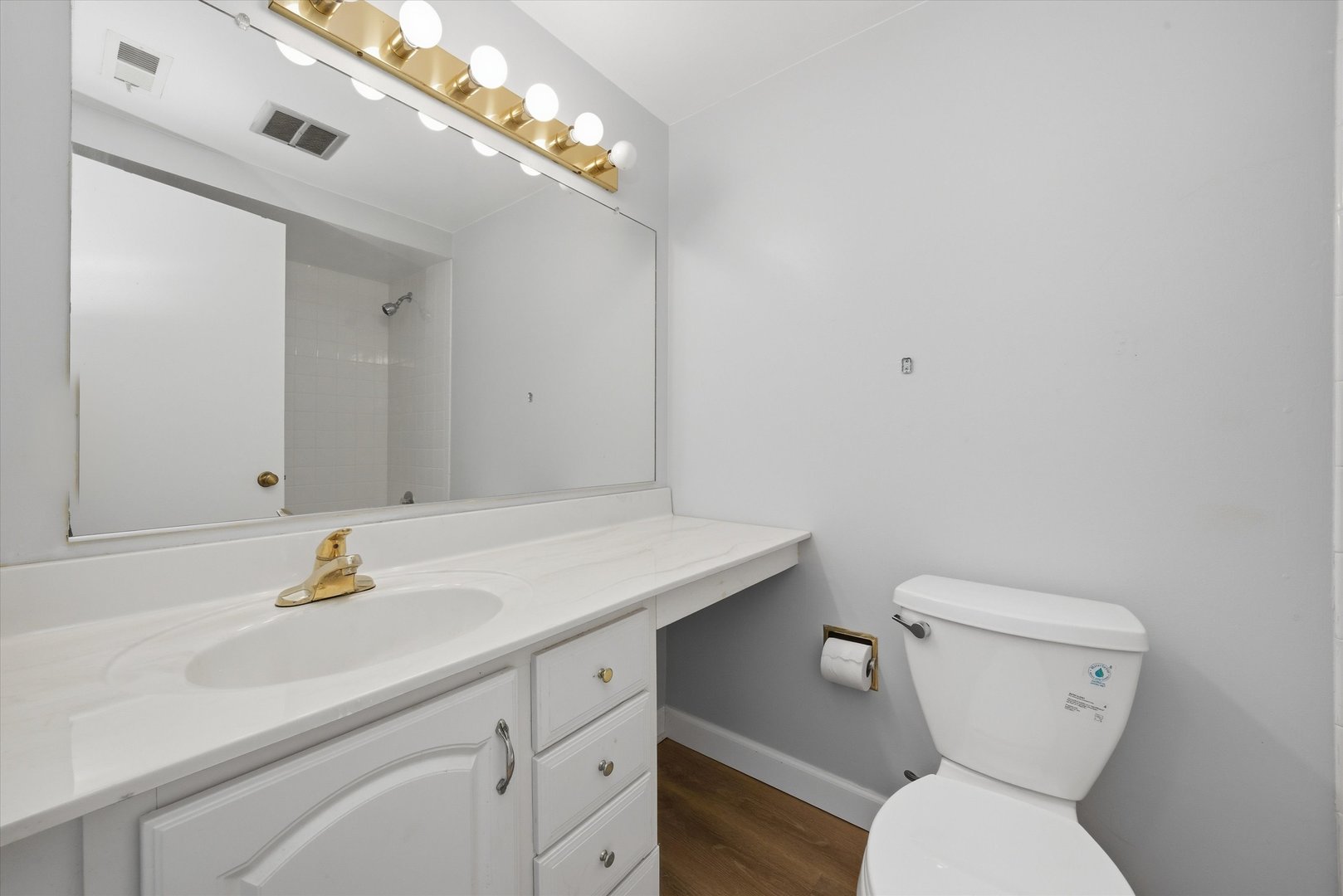 3207 West 184th Street, Unit 1A Homewood, IL 60430 - Photo 10 of 16 a bathroom with a toilet sink and mirror