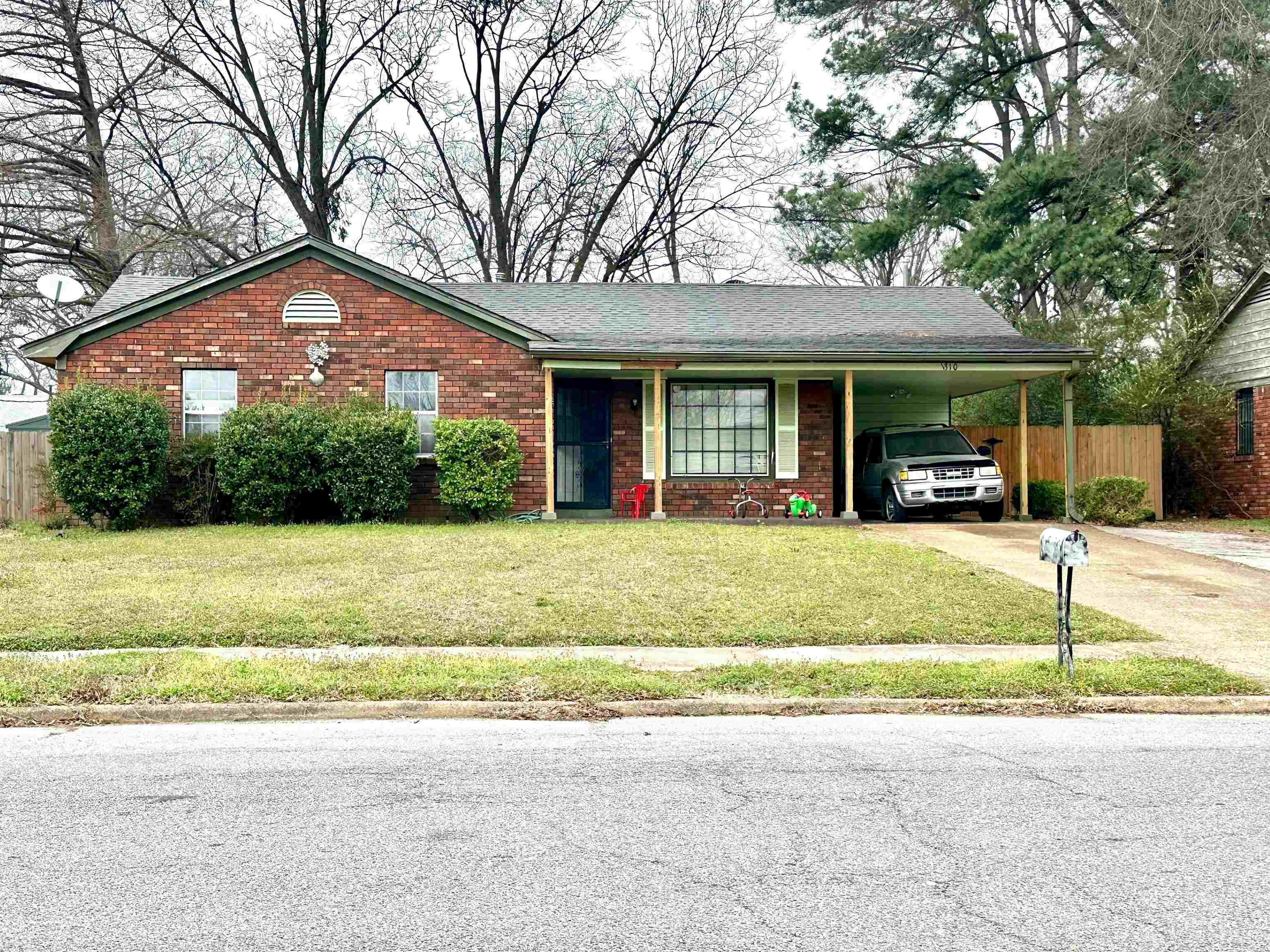 1310 Winfield Road Memphis, TN 38116 - Photo 1 of 1 a front view of a house with garden
