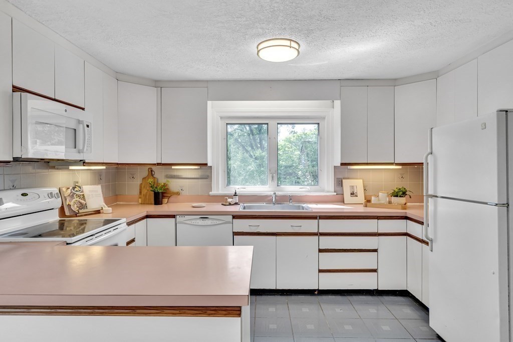 31 Park Drive Newton, MA 02461 - Photo 13 of 31 a kitchen with kitchen island sink stove and refrigerator