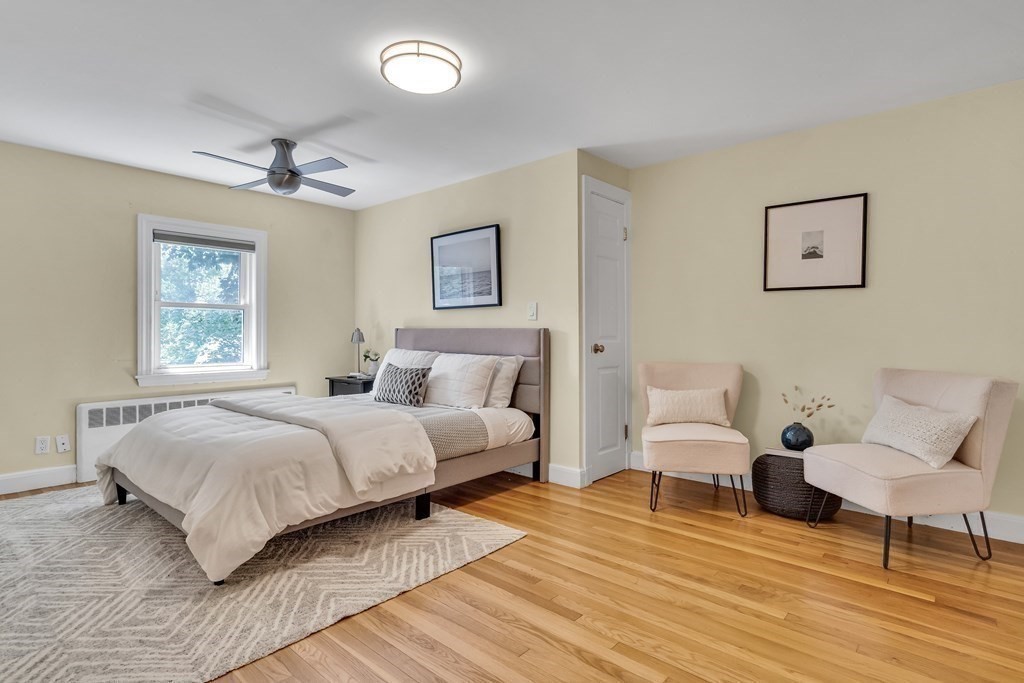 31 Park Drive Newton, MA 02461 - Photo 16 of 31 a bedroom with a bed and a chair