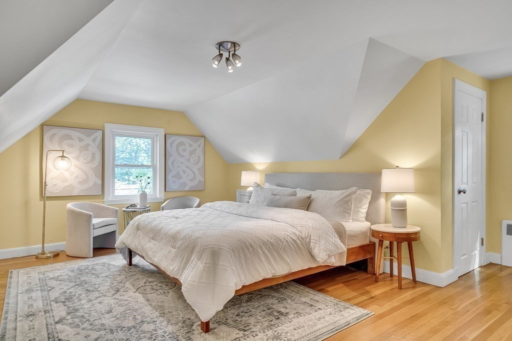 31 Park Drive Newton, MA 02461 - Photo 17 of 31 a bedroom with a bed and wooden floor