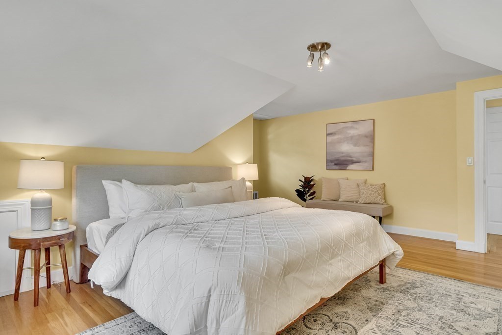 31 Park Drive Newton, MA 02461 - Photo 19 of 31 a bedroom with a bed and wooden floor