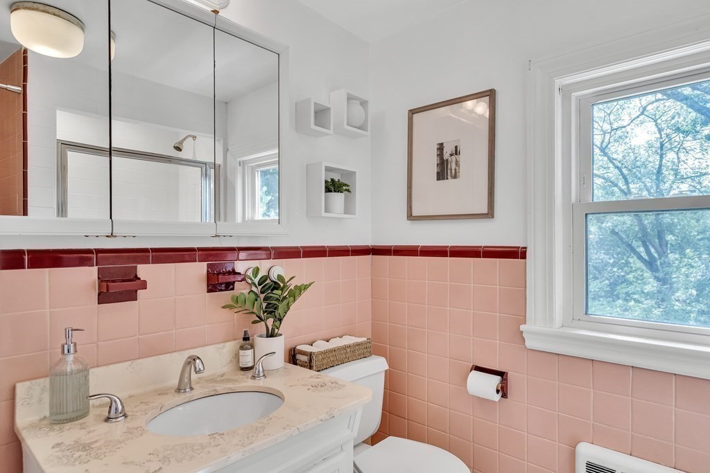 31 Park Drive Newton, MA 02461 - Photo 26 of 31 a bathroom with a granite countertop sink and a mirror