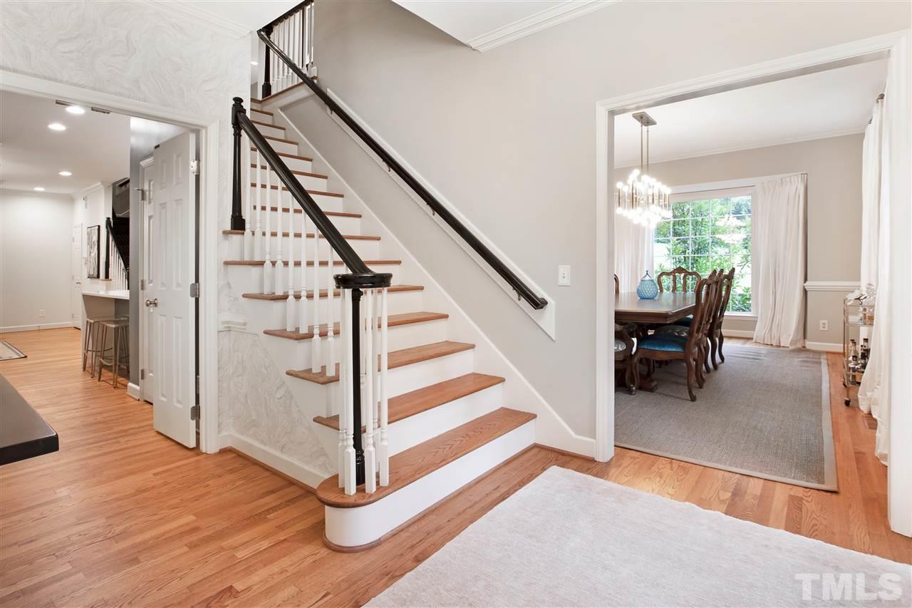 2324 Oxford Road Raleigh, NC 27608 - Photo 2 of 30 a view of a hallway with wooden floor and staircase