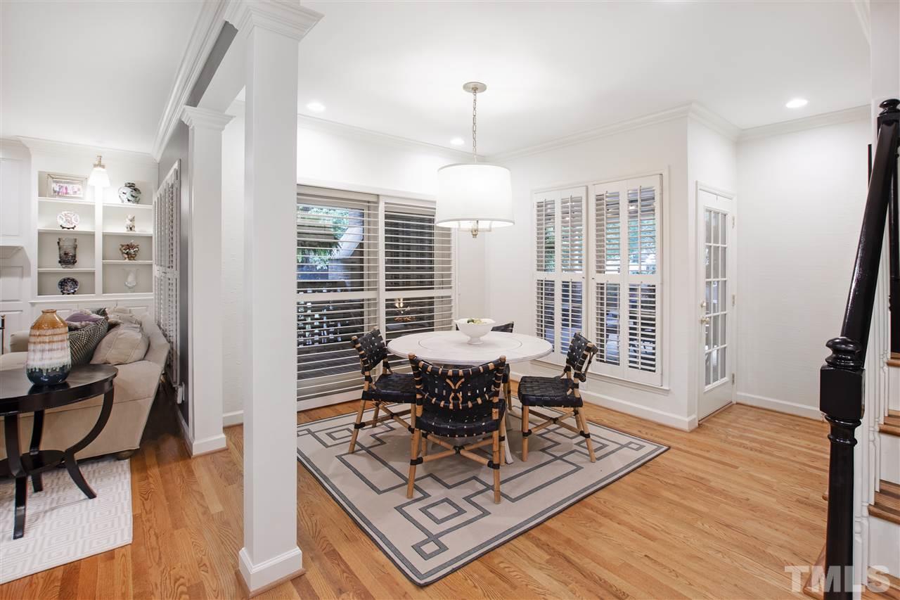 2324 Oxford Road Raleigh, NC 27608 - Photo 11 of 30 a living room with furniture a dining table and a large window
