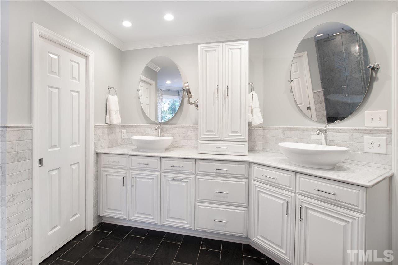 2324 Oxford Road Raleigh, NC 27608 - Photo 21 of 30 a bathroom with a sink vanity and mirror