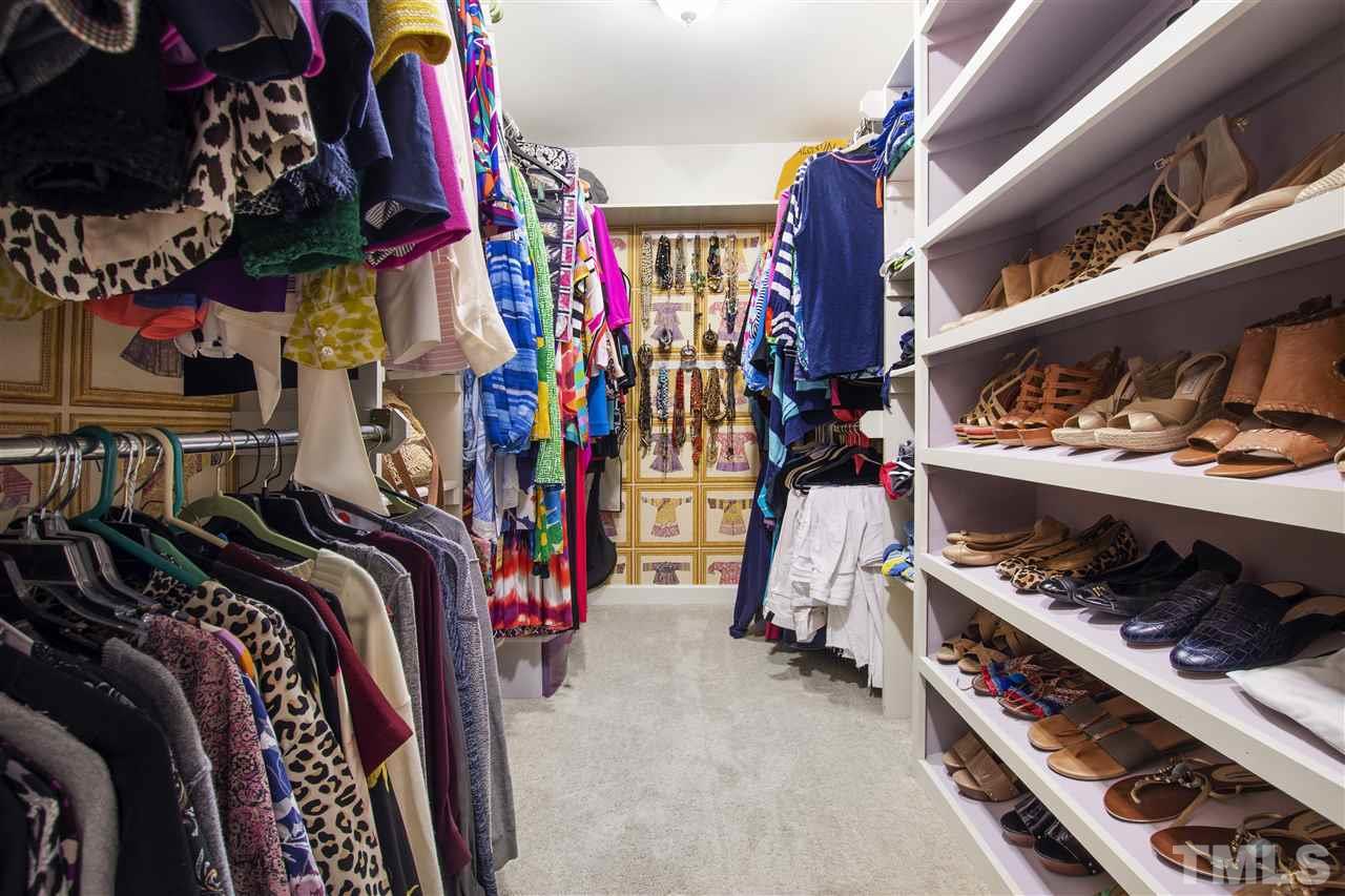 2324 Oxford Road Raleigh, NC 27608 - Photo 23 of 30 a view of walk in closet with clothes and shoes