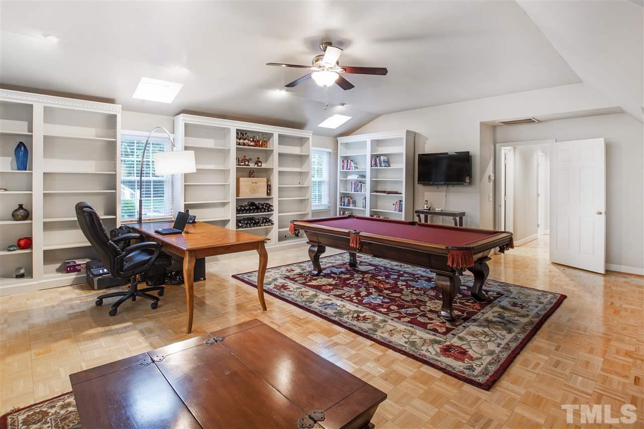 2324 Oxford Road Raleigh, NC 27608 - Photo 25 of 30 a living room with furniture a flat screen tv and a rug