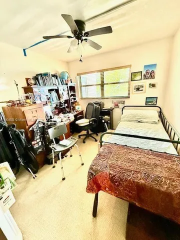 a bed room with a bed and a couch