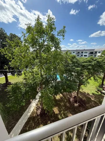 a view of a patio with a table and chairs