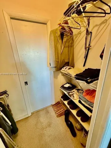 a view of a hallway with a large window