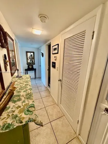 a view of a livingroom with furniture and staircase