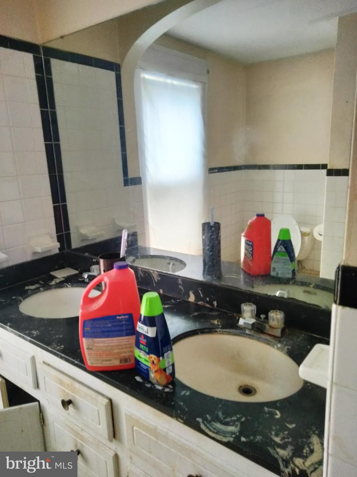 7411 Main Street Willards, MD 21874 - Photo 18 of 43 a bathroom with a sink mirror and vanity