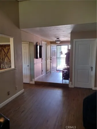 a view of entryway with wooden floor