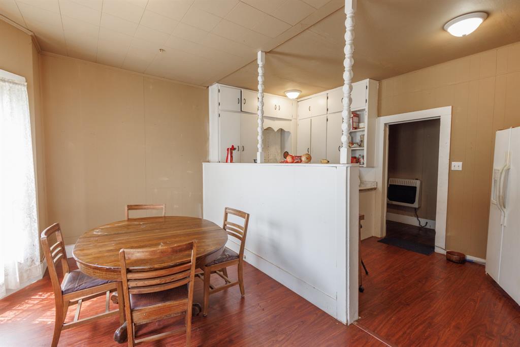 2202 Chester Street Sweetwater, TX 79556 - Photo 16 of 21 a dining room with furniture and wooden floor