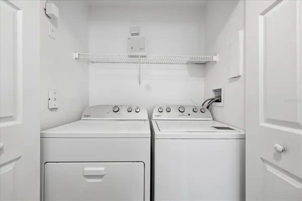 a utility room with dryer and washer