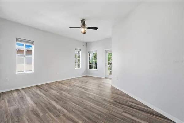 wooden floor in an empty room with a window