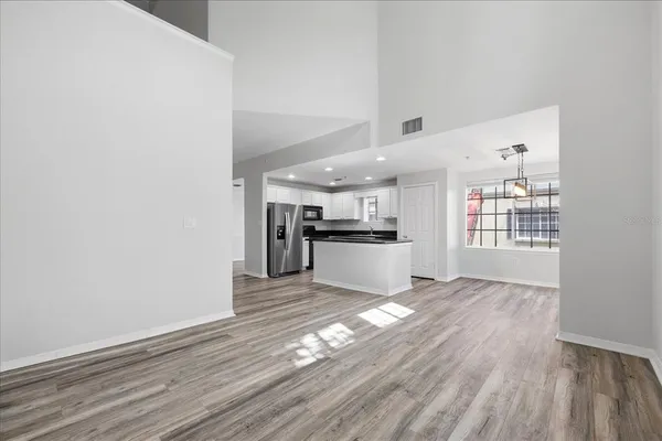 a view of kitchen with wooden floor