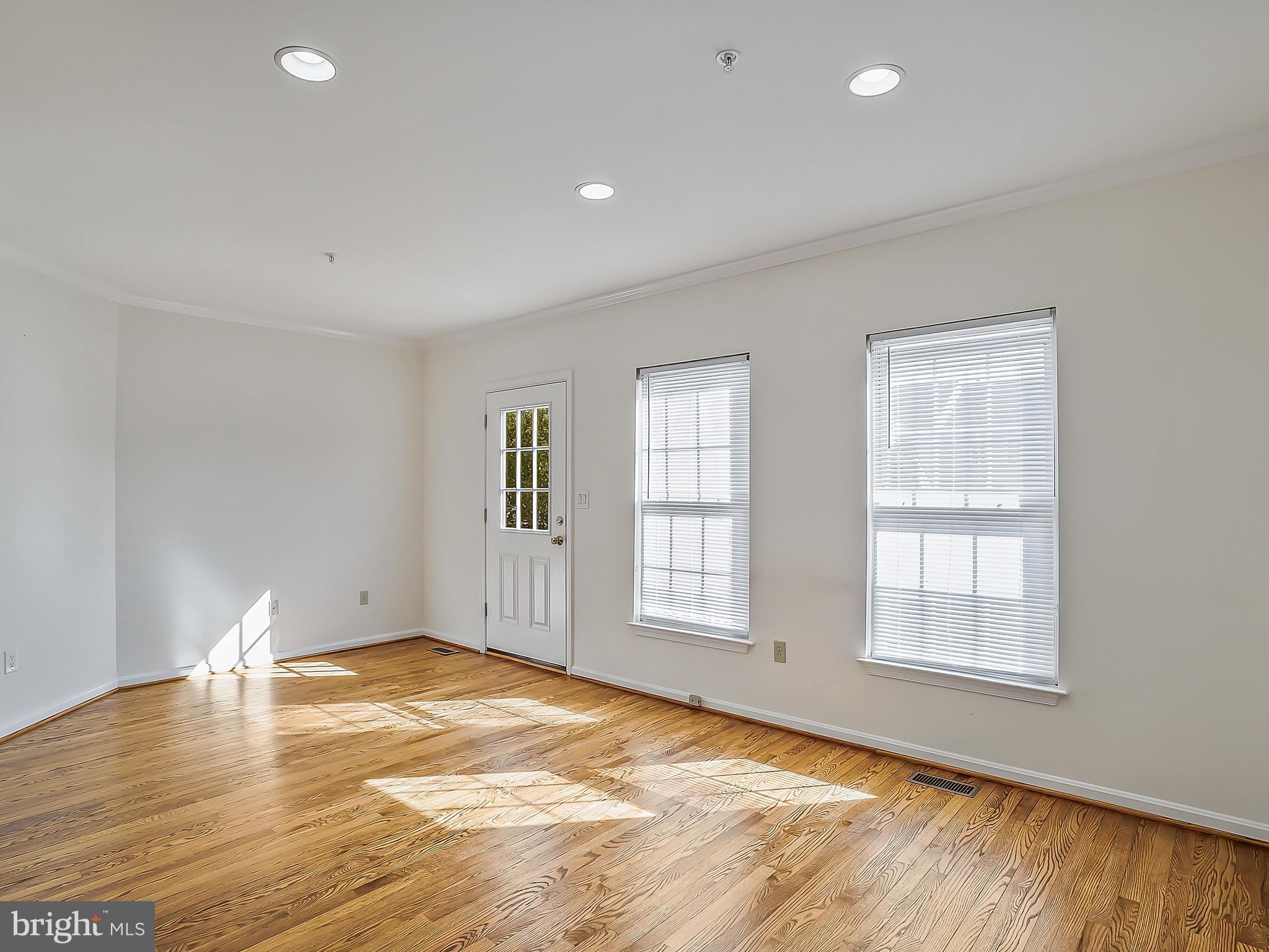 16820 Centerfield Way Olney, MD 20832 - Photo 19 of 48 Living Room with Rear Exit to Yard and Driveway