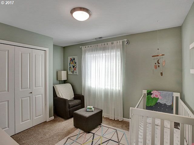 9478 Northwest Ember Lane Portland, OR 97229 - Photo 13 of 23 a living room with furniture and a window